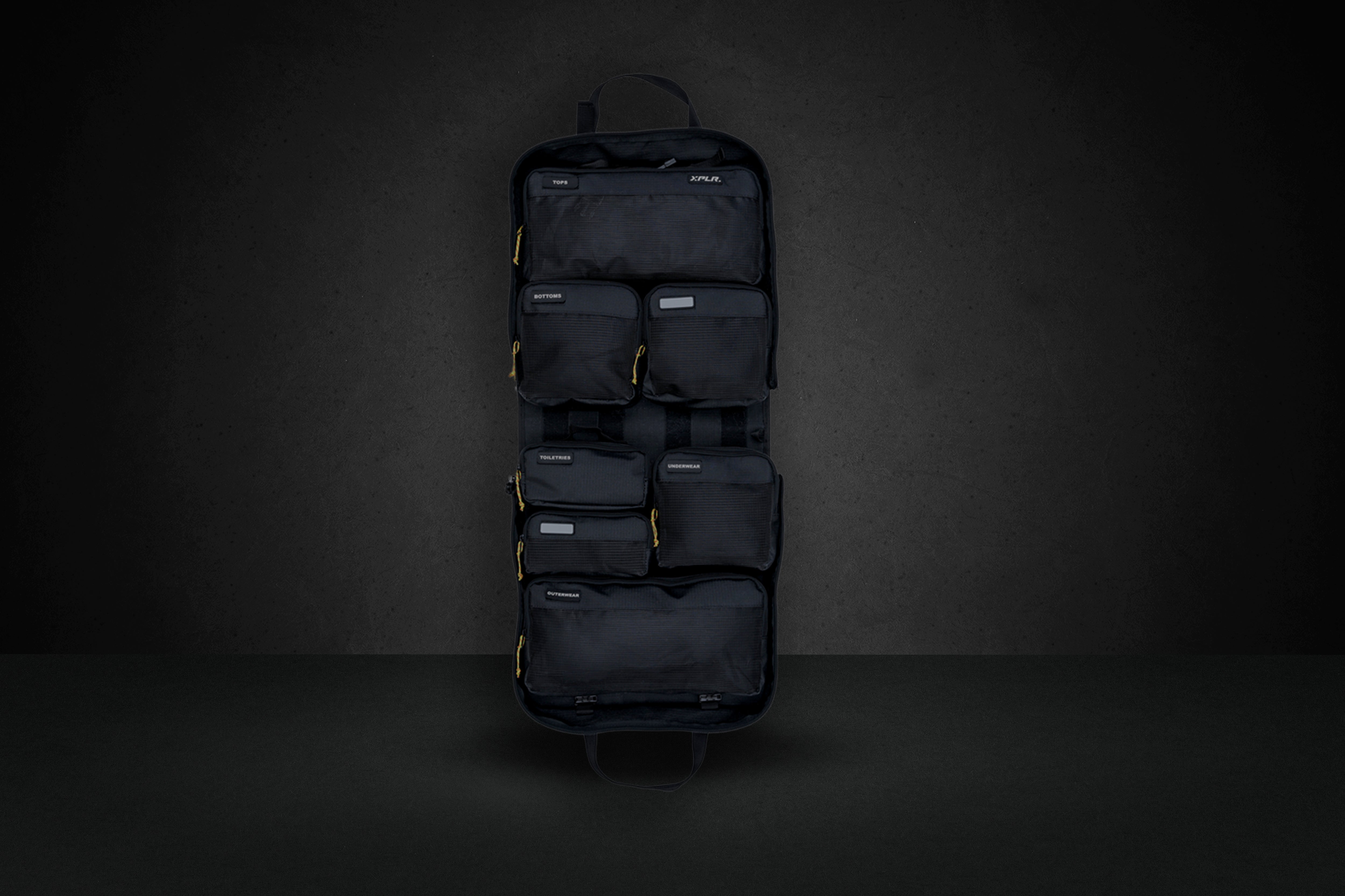 An XPLR modular duffel laid open with its packing cubes
